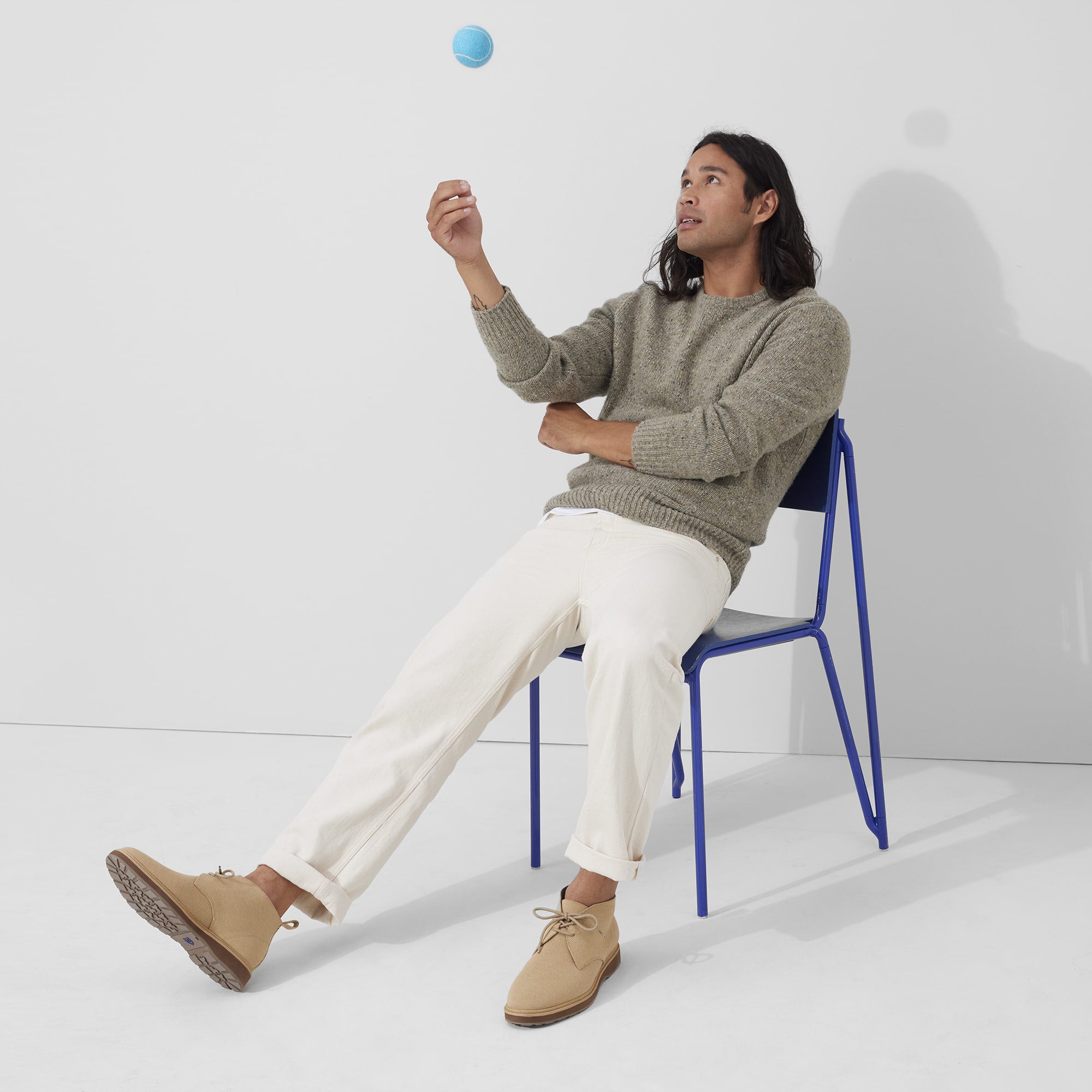 Alternate view of a model wearing The Chukka Boot in Desert Sand.