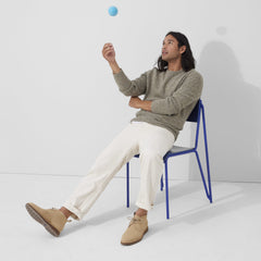 Alternate view of a model wearing The Chukka Boot in Desert Sand.