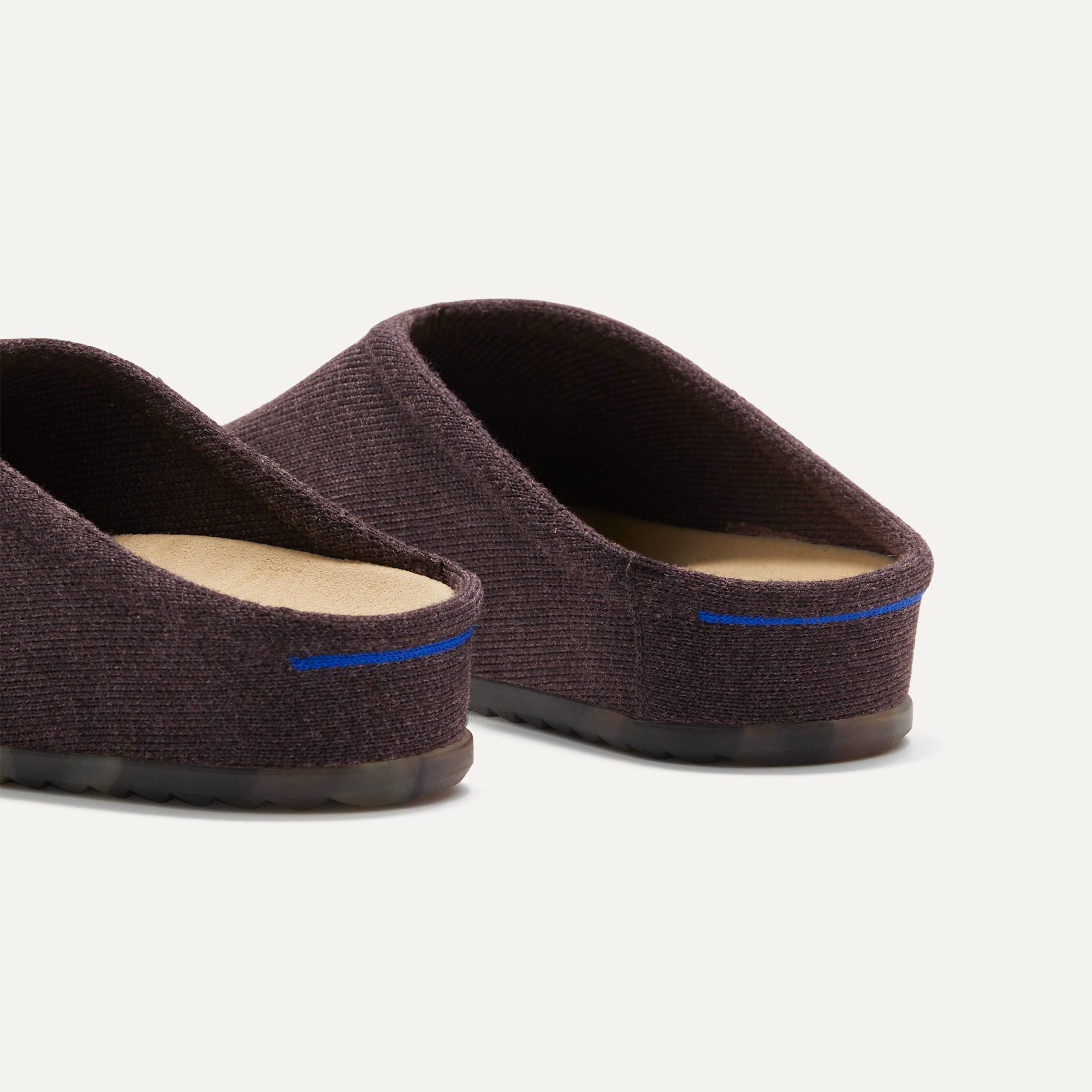 Close up of the heel of The Casual Clog in Chestnut, with Rothy's signature blue halo.