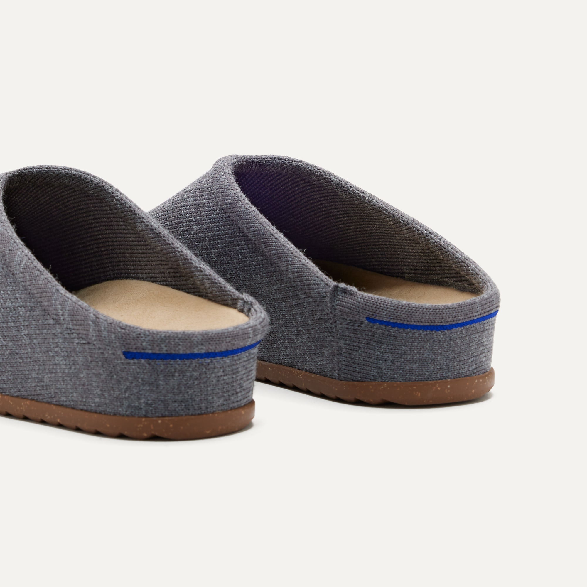 Close up of the heel of The Casual Clog in Mountain Grey, with Rothy's signature blue halo.