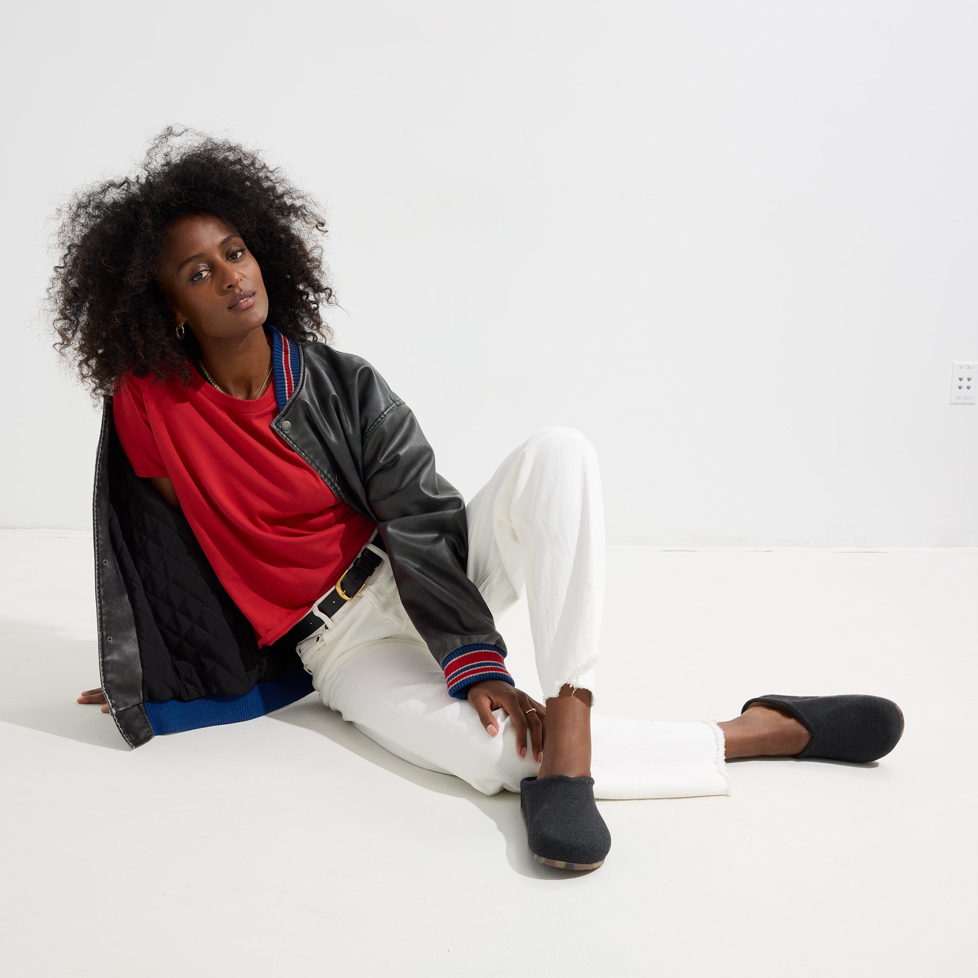 Alternate view of a model wearing The Casual Clog in Soft Black.