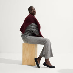 Alternate view of a model wearing The Point II in Black Boucle.