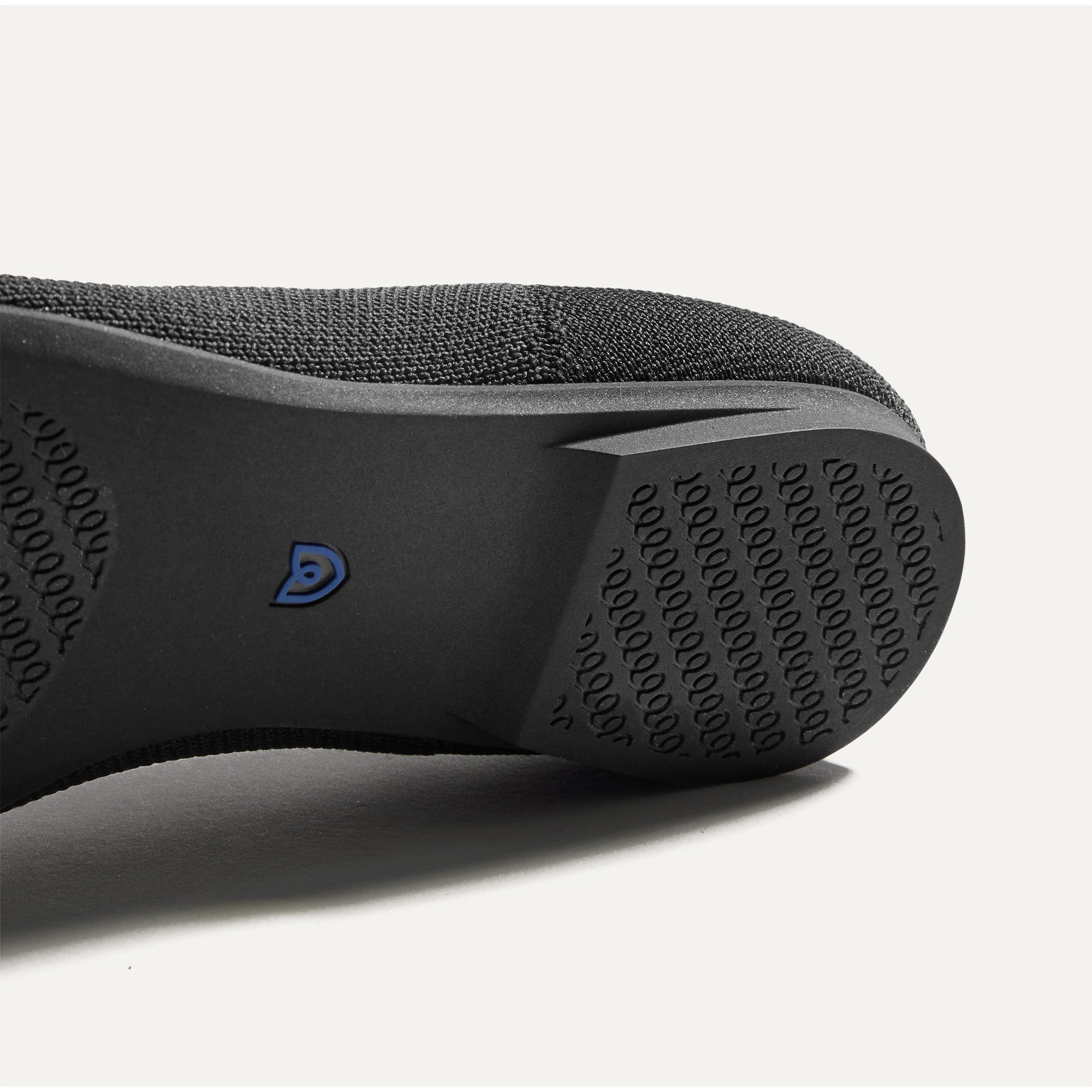 Close up of the outsole of The Point II in Black, shown in a diagonal view.