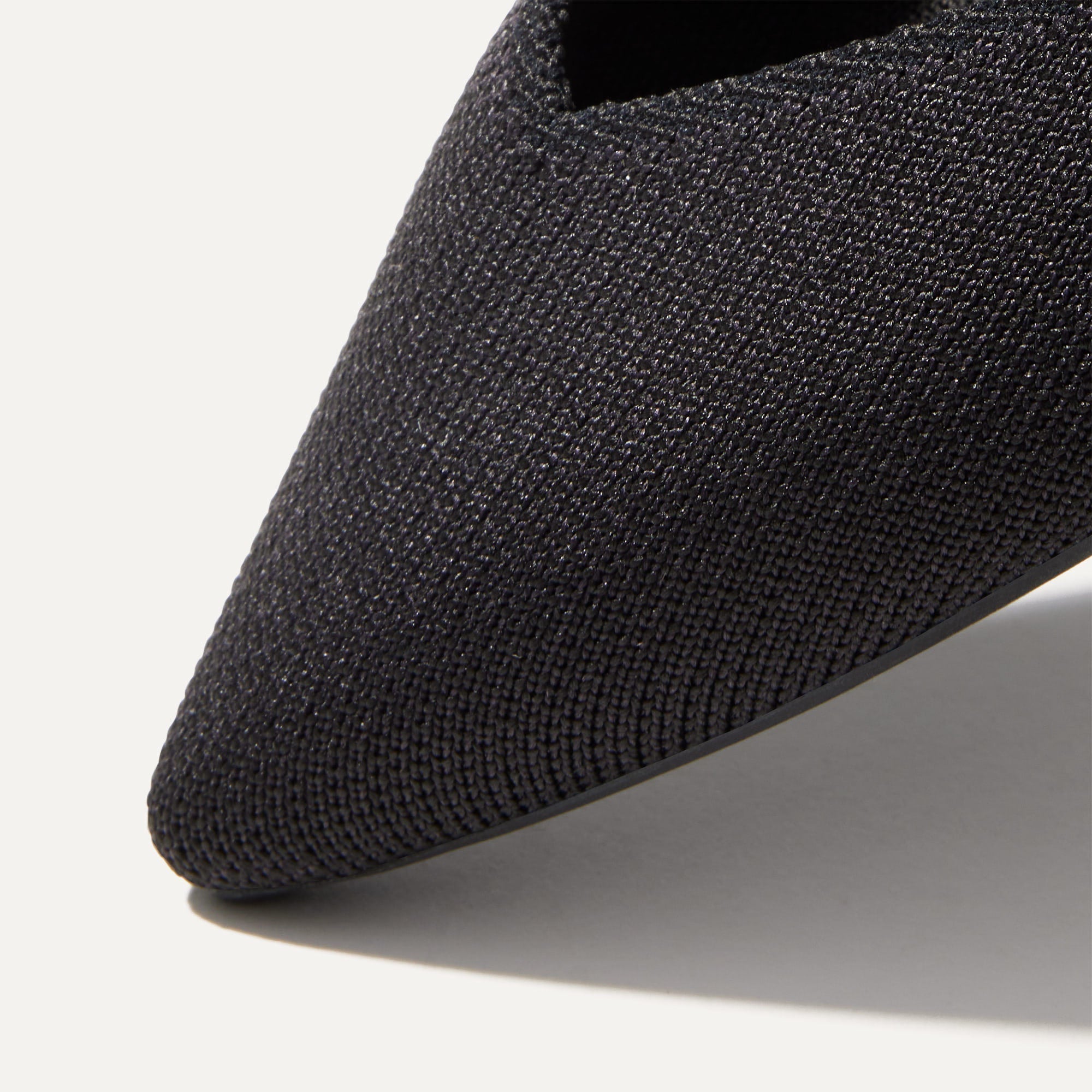 Close up of The Point II in Black, shown in diagonal view. 