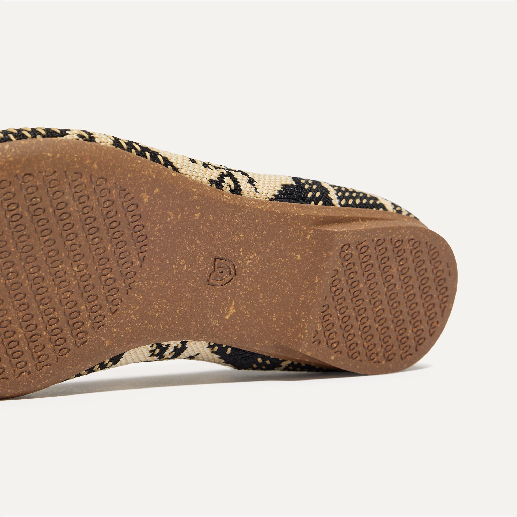 Close up of the outsole of The Point II in Bouquet, shown in a diagonal view. 