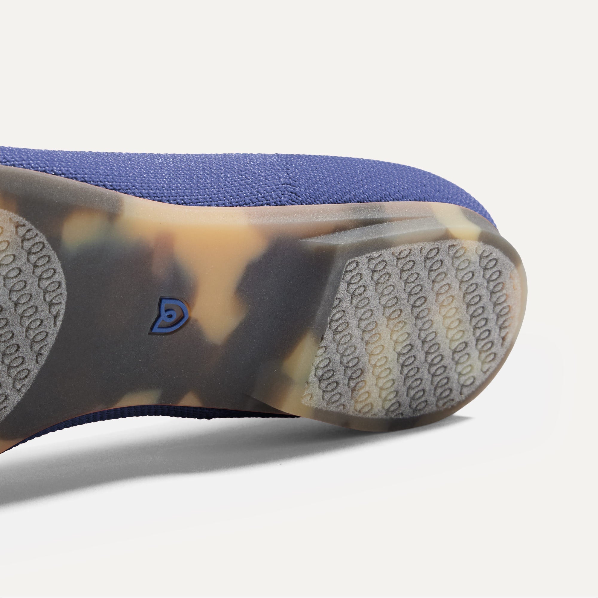 Close up of the outsole of The Point II in Dark Navy, shown in a diagonal view.
