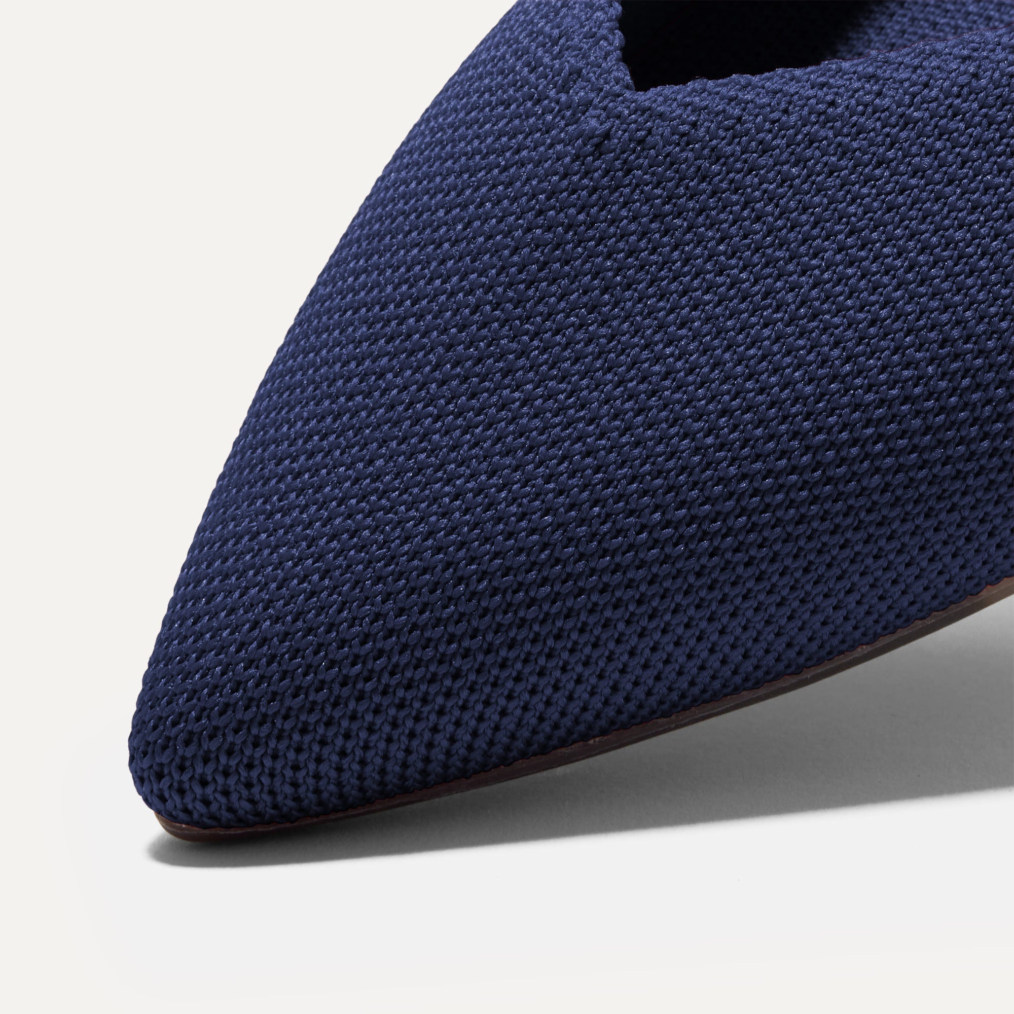 Close up of The Point II in Dark Navy, shown in diagonal view.