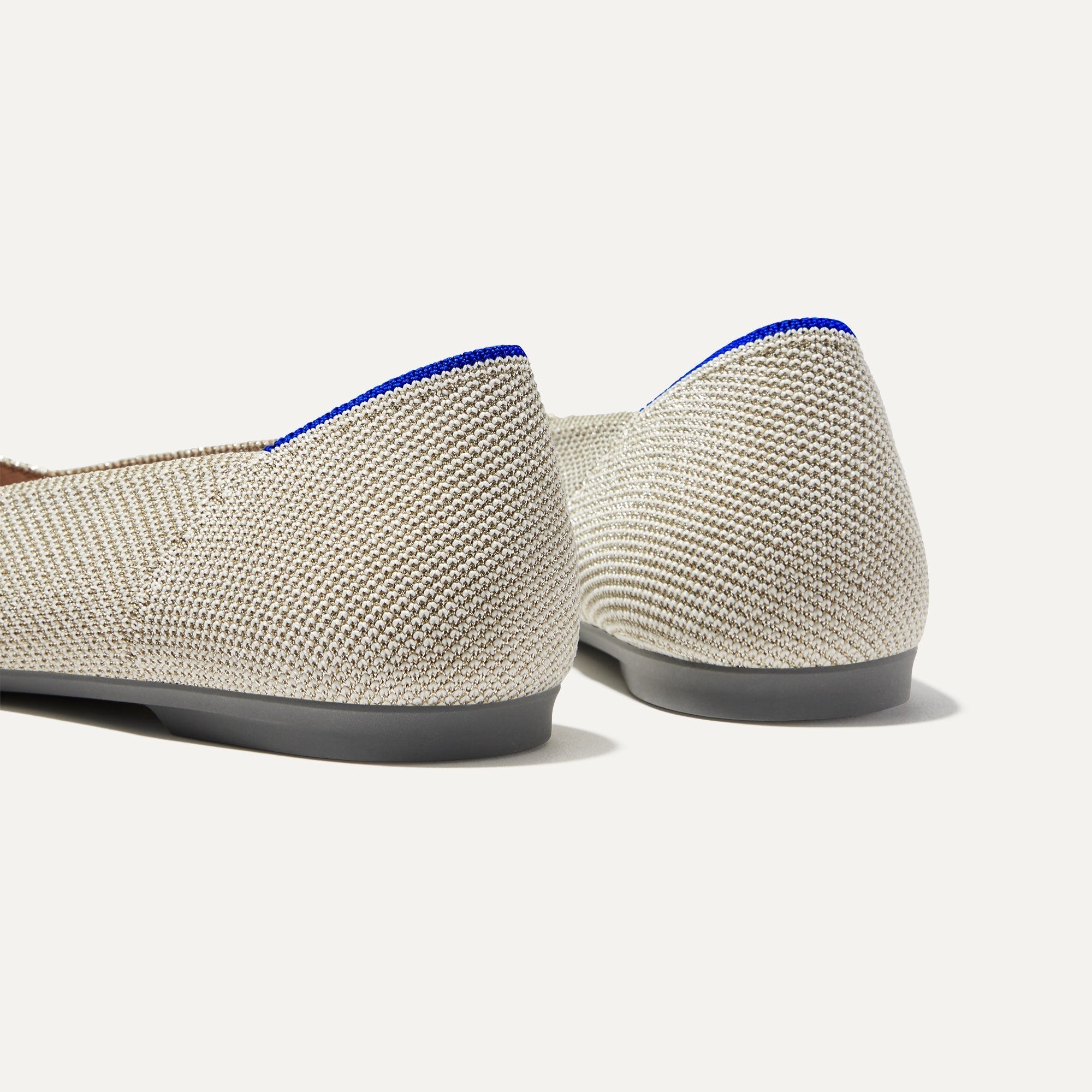 Close up of the heel of The Point II in Diamond Twill, with Rothy's signature blue halo. 