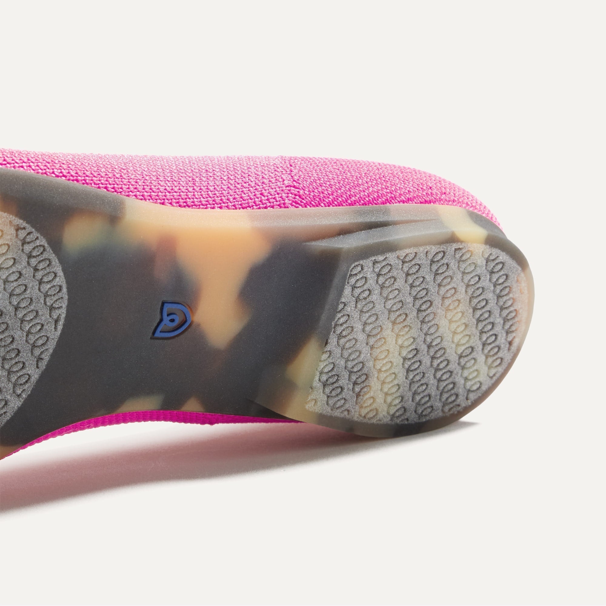 Close up of the outsole of The Point II in Dragon Fruit, shown in a diagonal view.