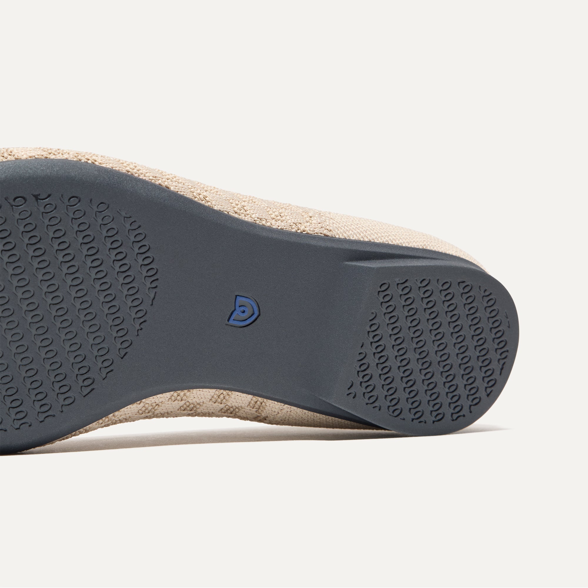 Close up of the outsole of The Point II in Frappe Basketweave, shown in a diagonal view. 