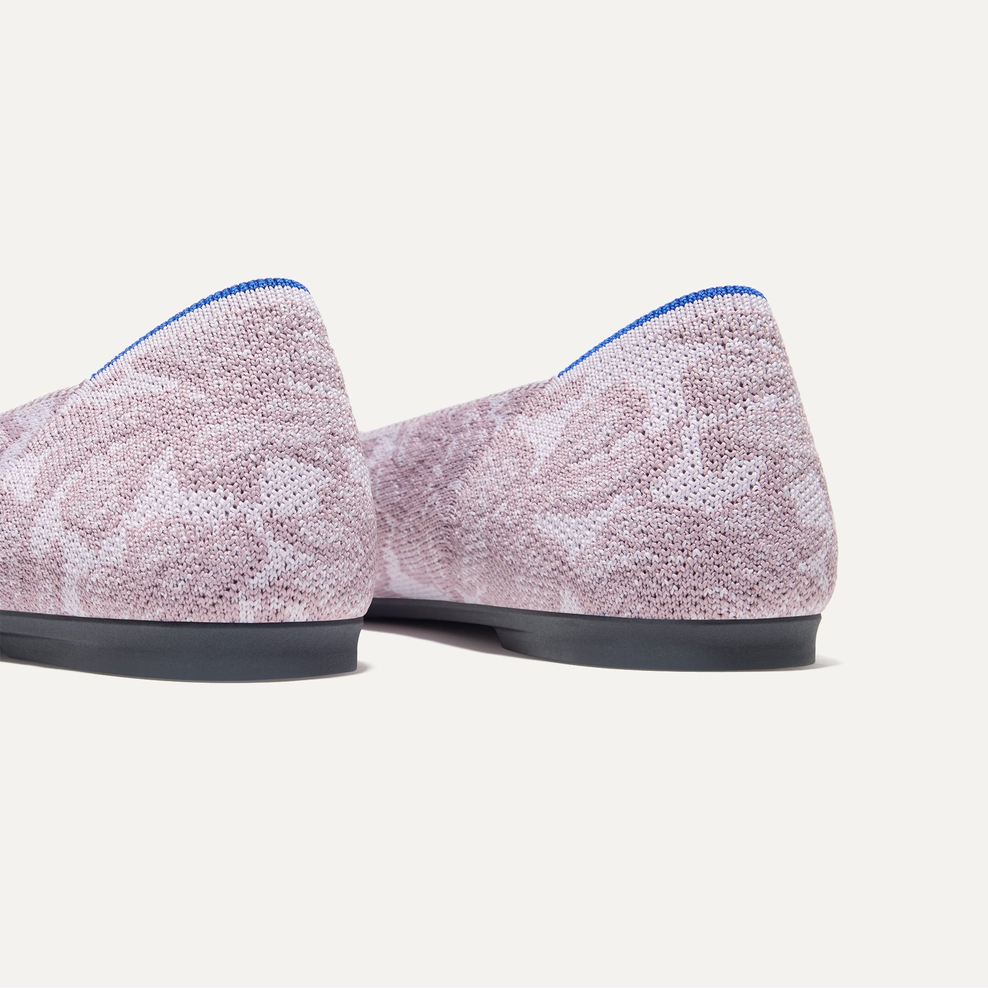 Close up of the heel of The Point II in Lilac Chantilly, with Rothy's signature blue halo. 