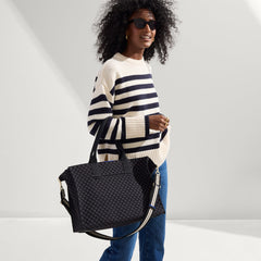 hover | The Crossbody Strap in Black and White Stripe, shown paired with The Classic Tote, worn by a model, shown from the side
