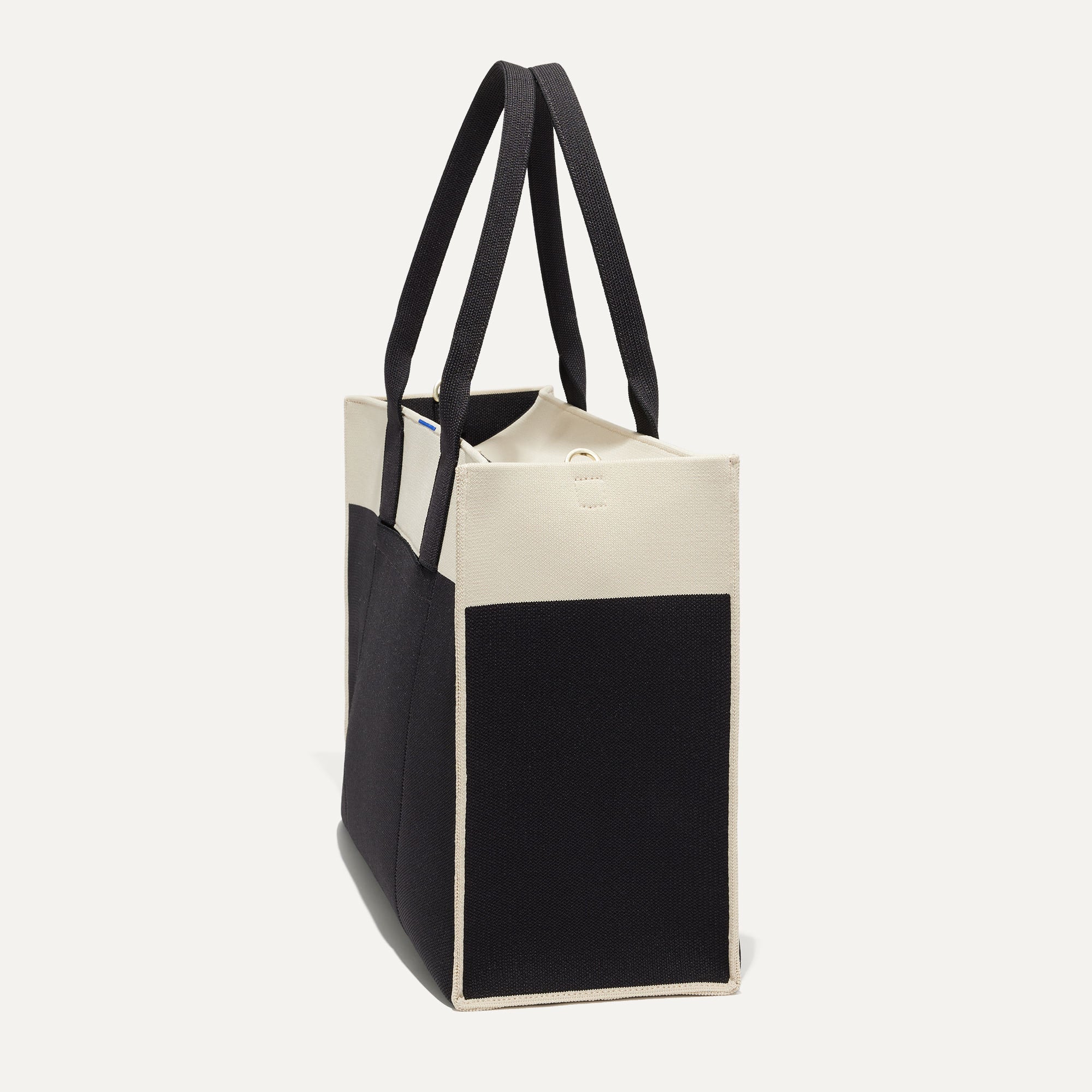 The Classic Tote in Luna, shown from the side.
