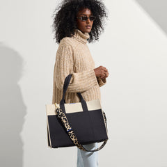 hover | The Crossbody Strap in Desert Cat, shown paired with The Classic Tote, worn by a model, shown from the side