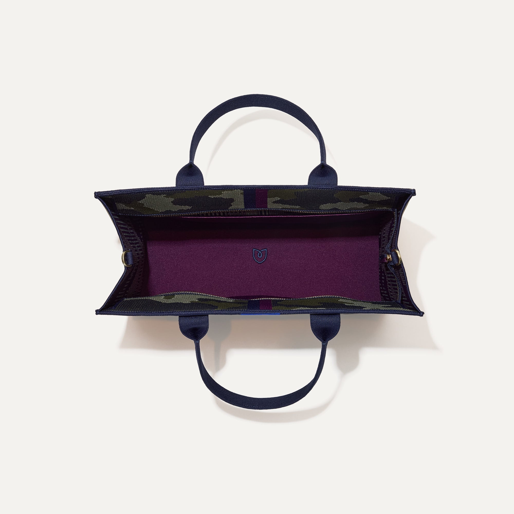 The Classic Tote in Spruce Camo, shown from above, with the interior exposed.