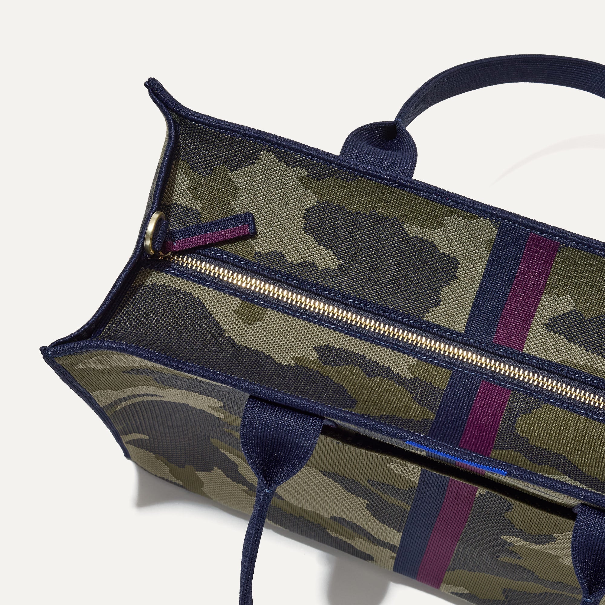 The Classic Tote in Spruce Camo, shown from above, with the top zipper closed. 