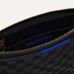 A closeup of The Wallet Wristlet in Night Song, focusing on the inner card slip.