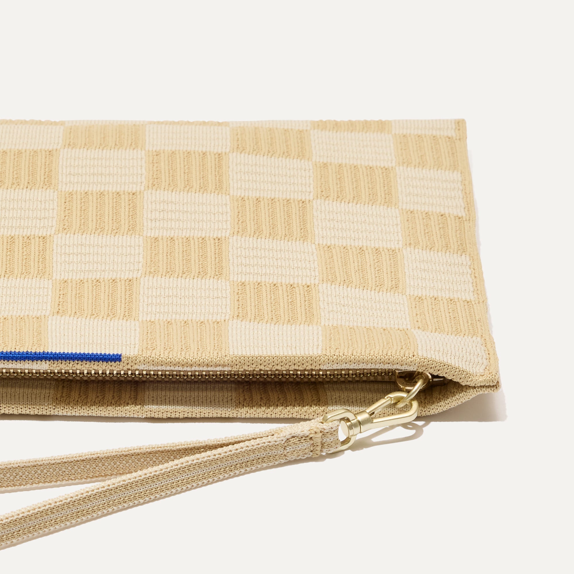 The Wristlet in Checker Sand interior view with Rothy's halo detail.