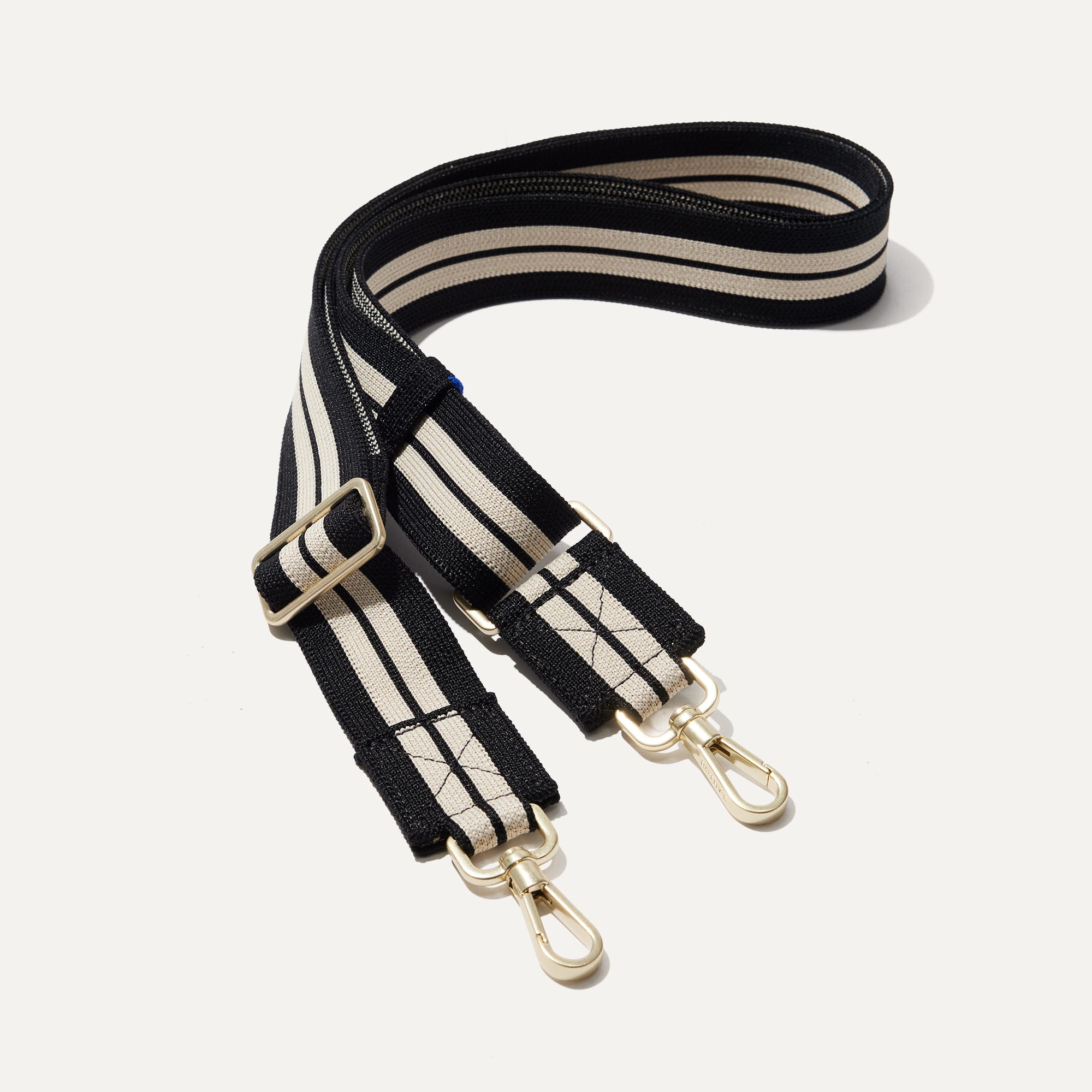 The Crossbody Strap in Black and White Stripe.