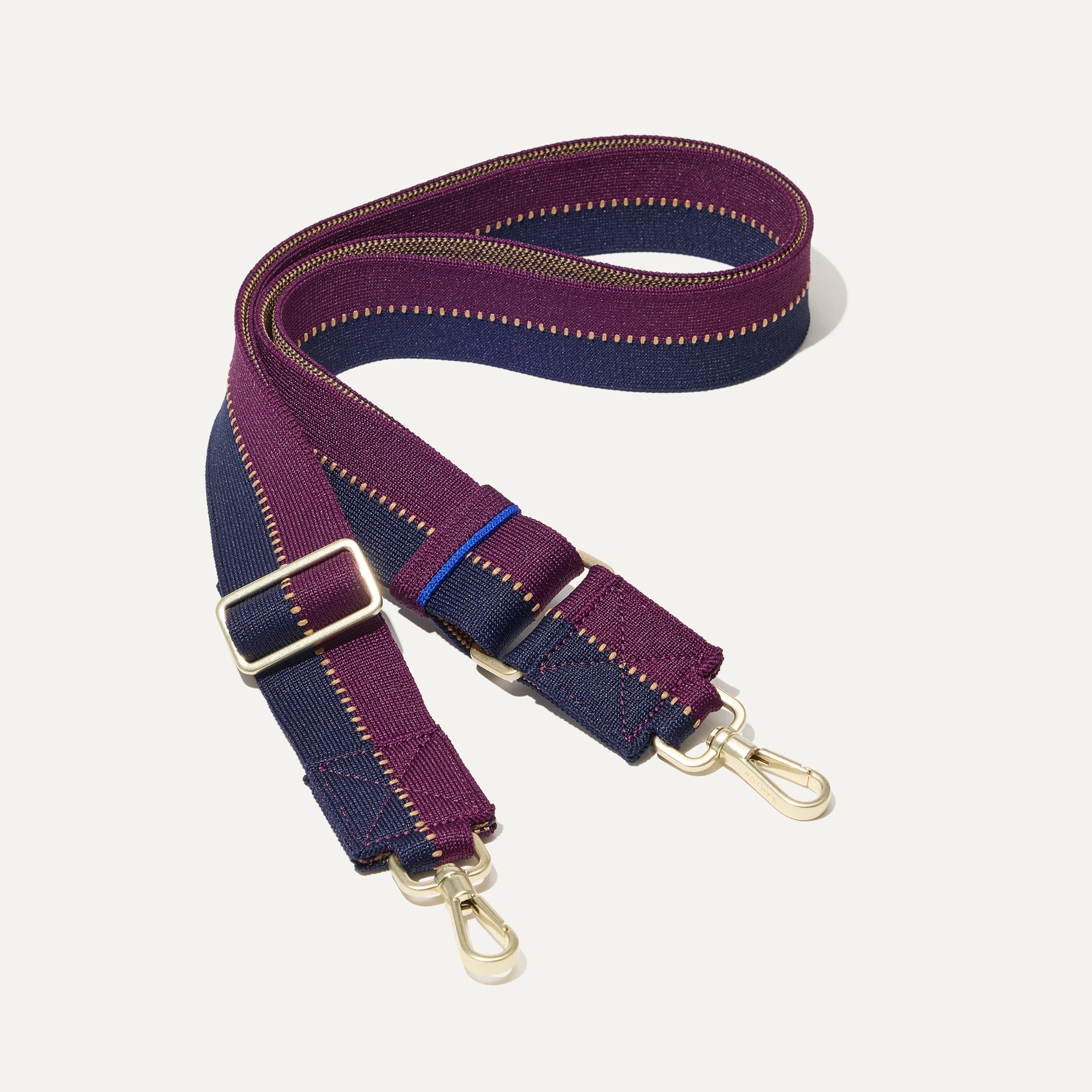 The Crossbody Strap in Dark Aubergine.