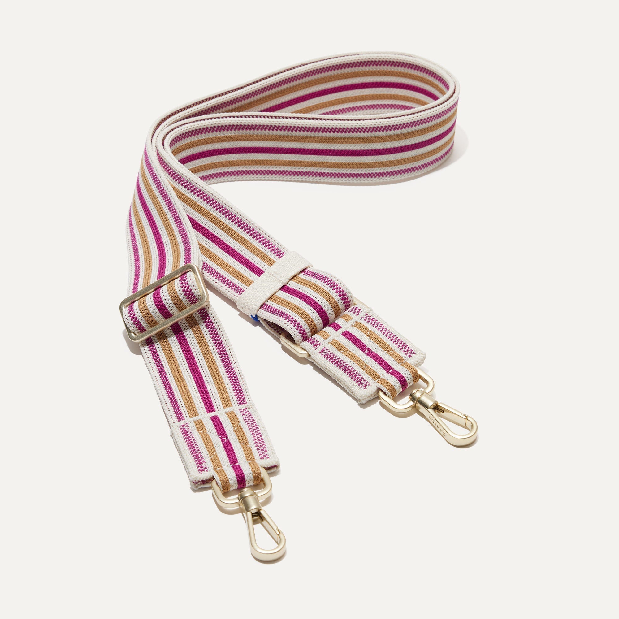 The Crossbody Strap in Fuchsia Stripe.