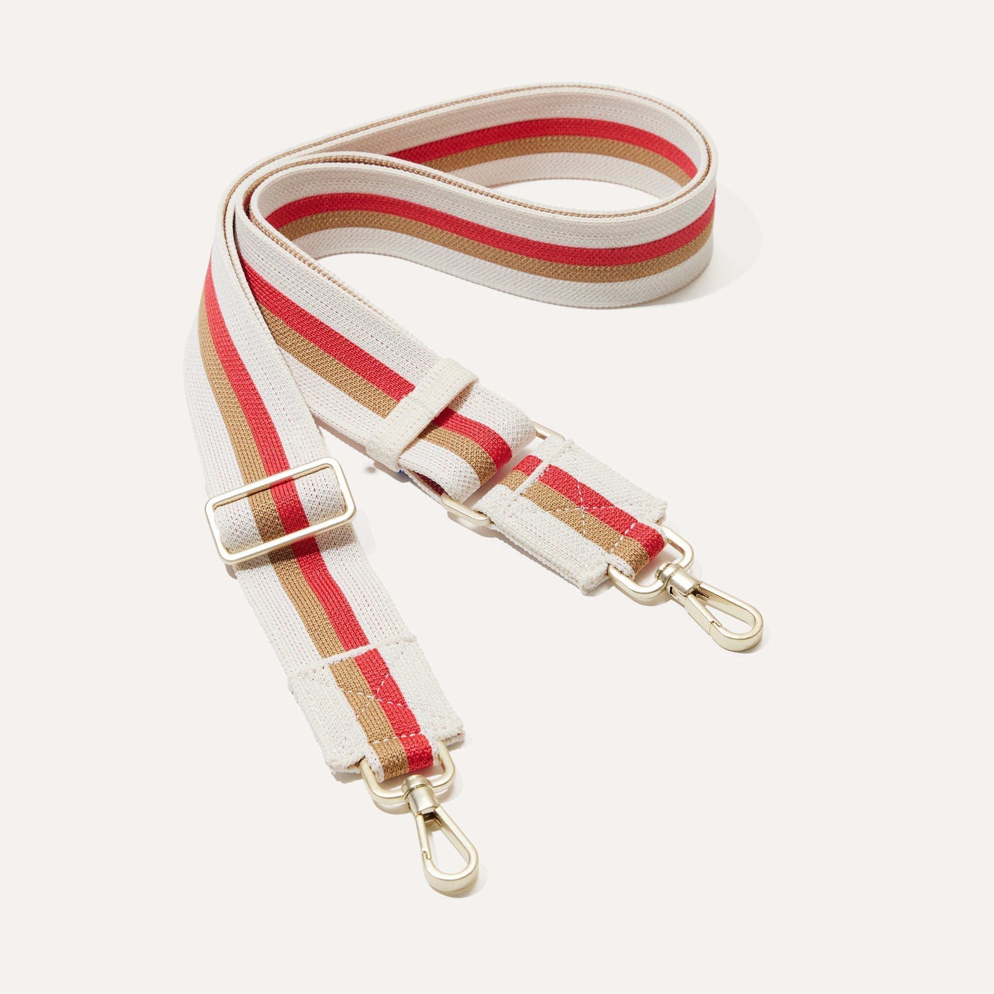 The Crossbody Strap in Maple Stripe.