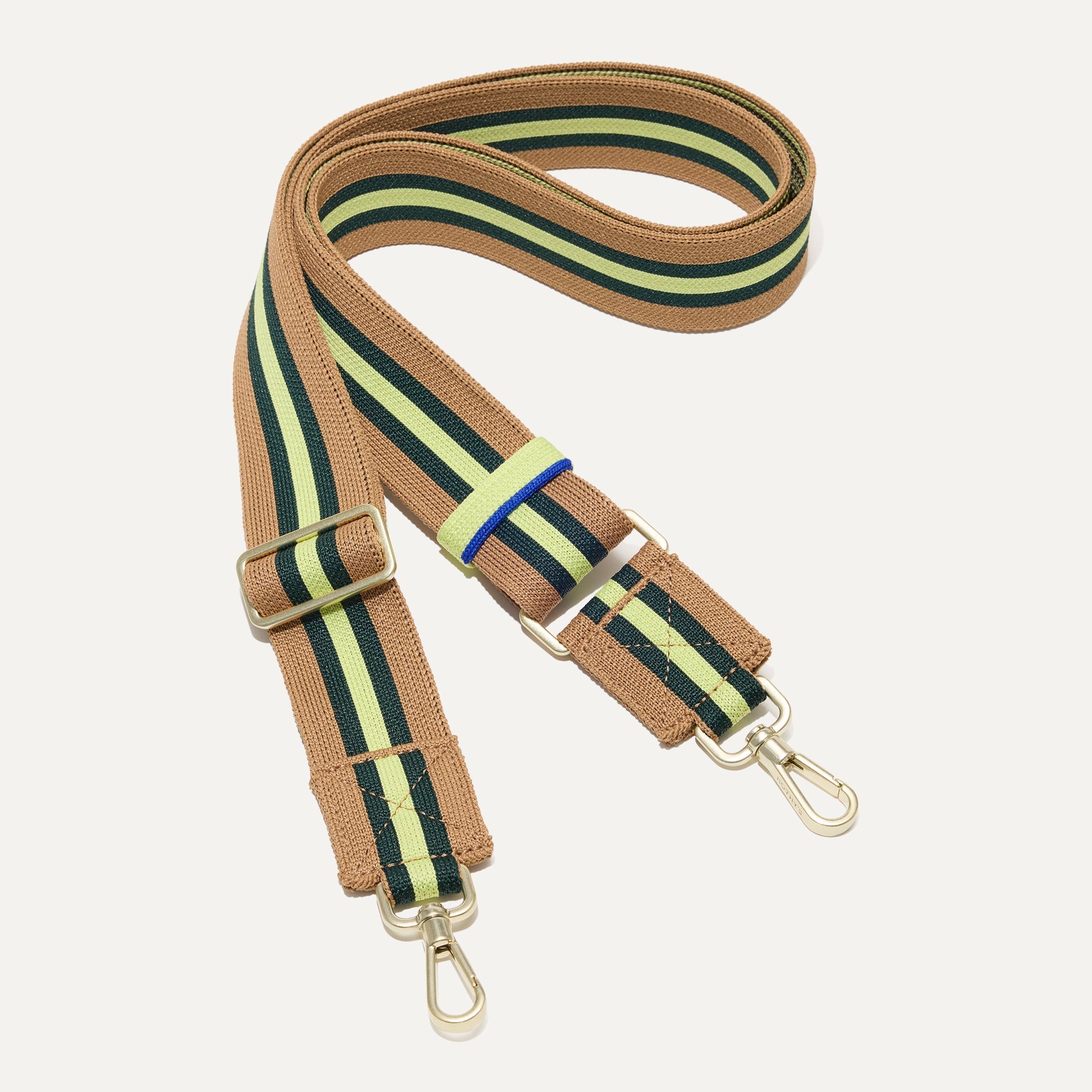 The Crossbody Strap in Neon Pine Stripe.
