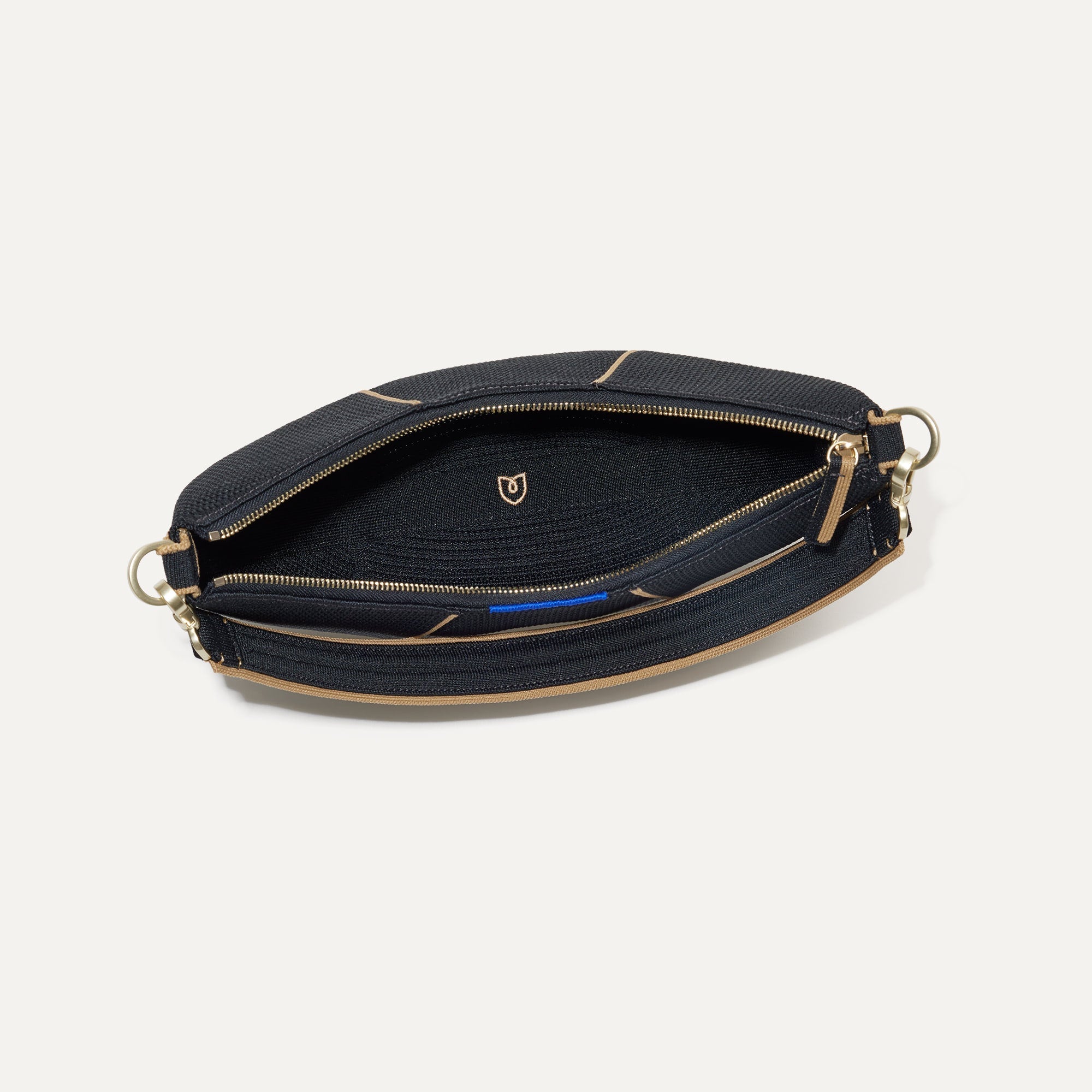 The Crescent Bag in Black, shown from above with the interior exposed. 