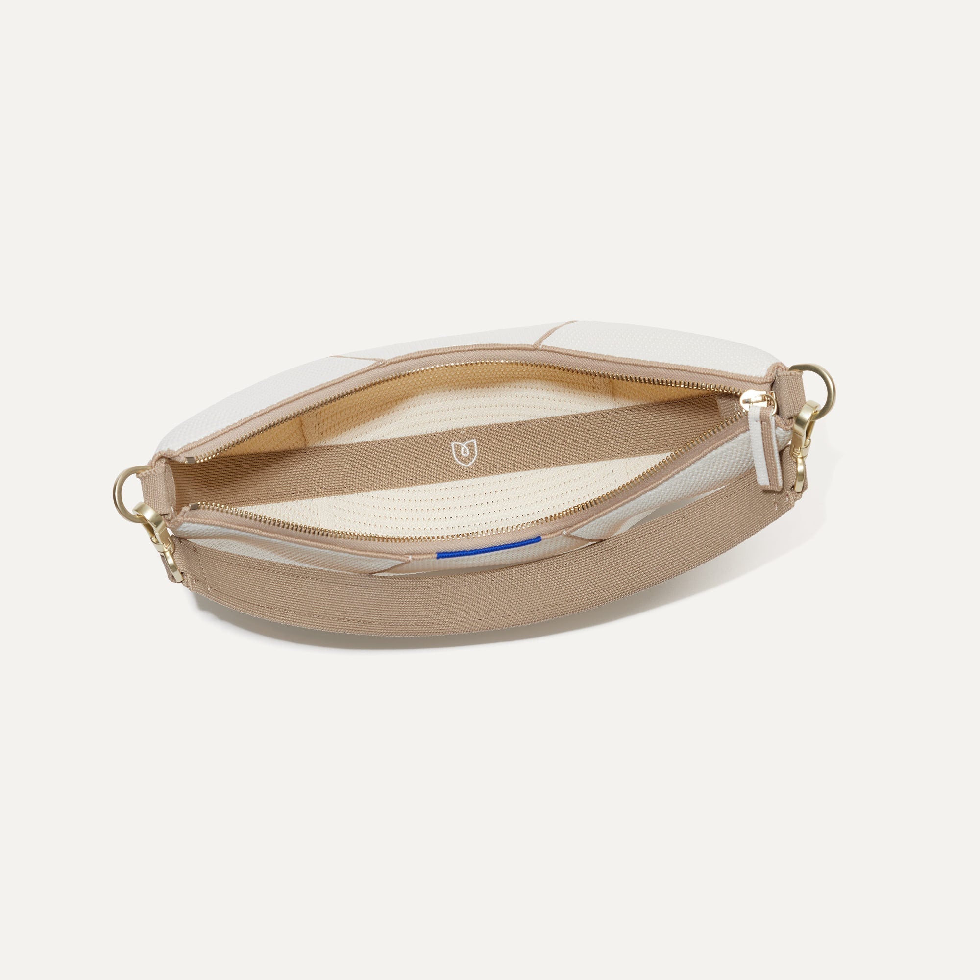 The Crescent Bag in Celestine, shown from above with the interior exposed. 