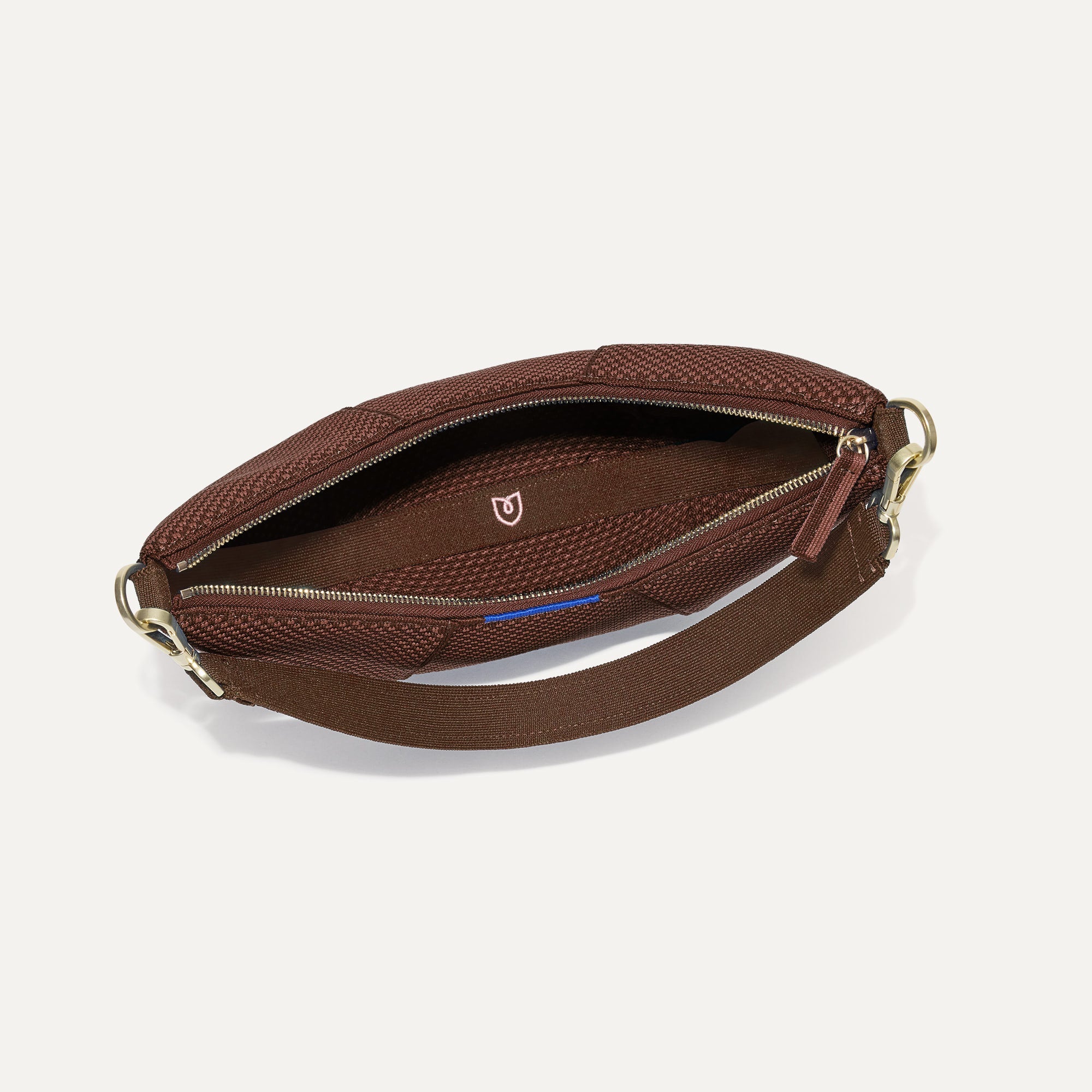 The Crescent Bag in Eclipse, shown from above with the interior exposed.