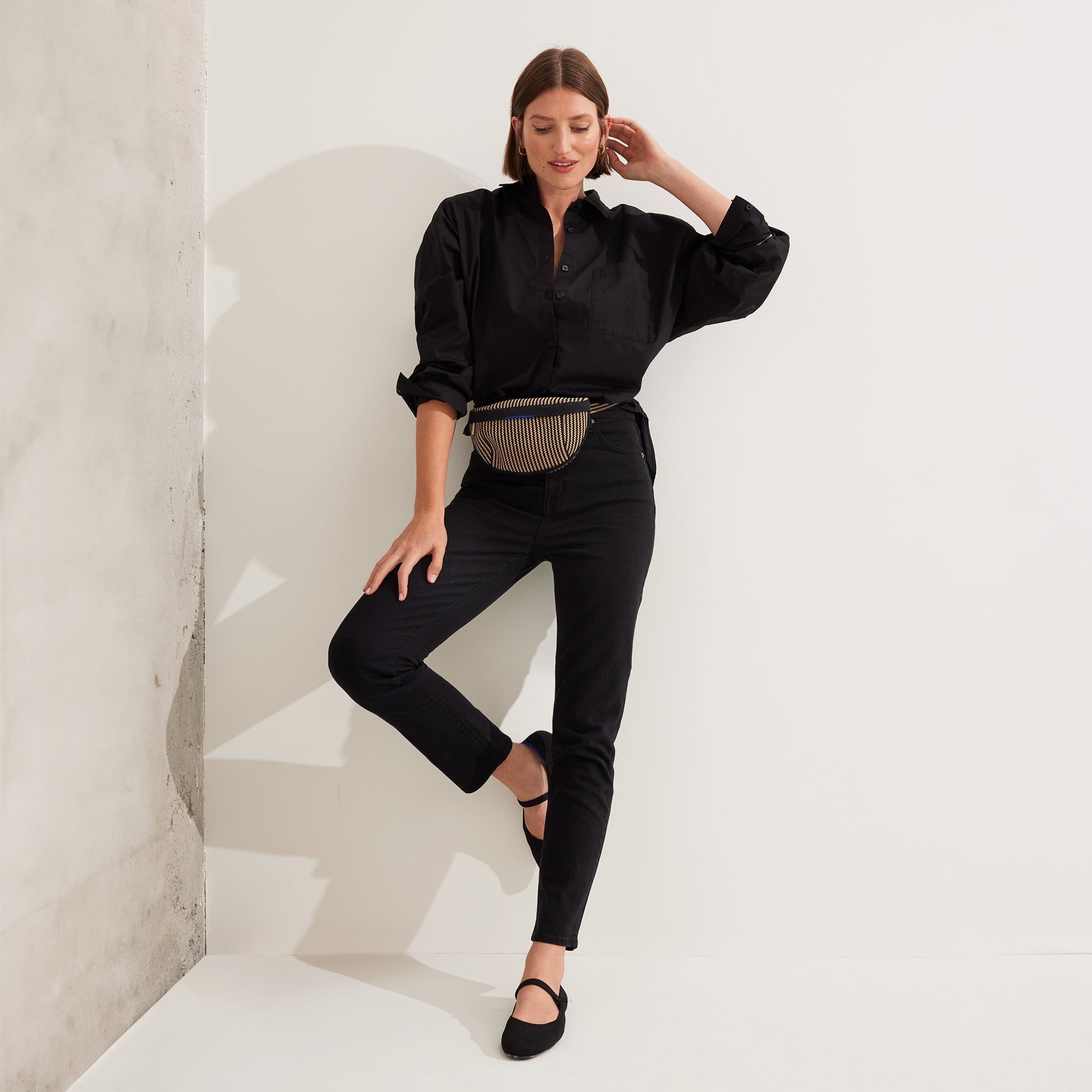 Another view of model wearing The Casual Sling in Toffee Stripe.