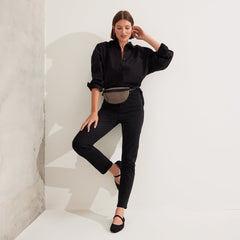 Another view of model wearing The Casual Sling in Toffee Stripe.