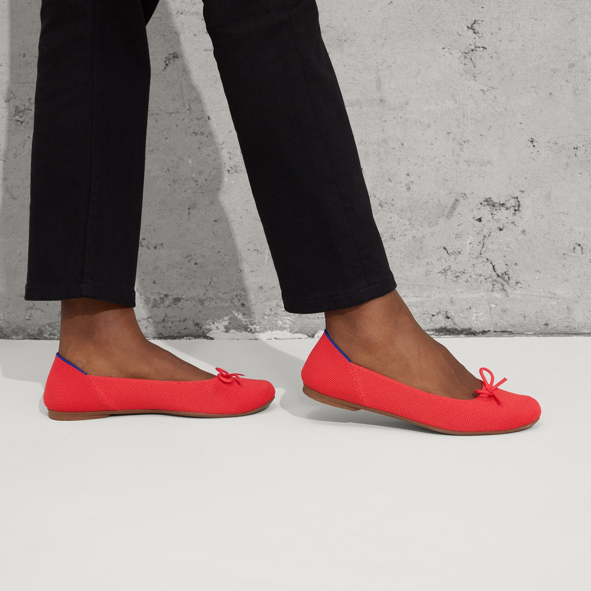 hover | Model wearing The Ballet Flat in Glamour Red.