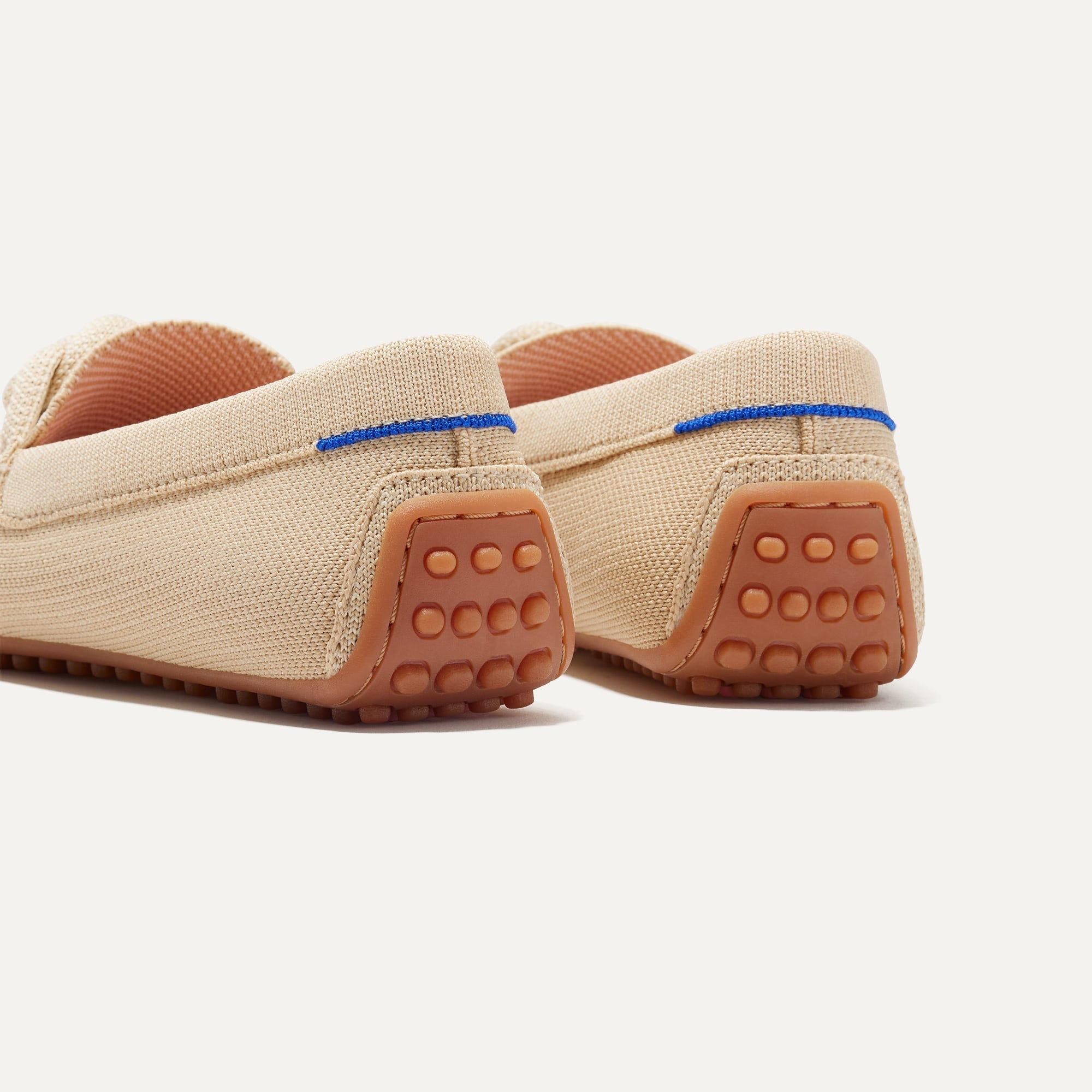 Close up of the heel of The Braid Driver in Cappuccino, with Rothy's signature blue halo. 