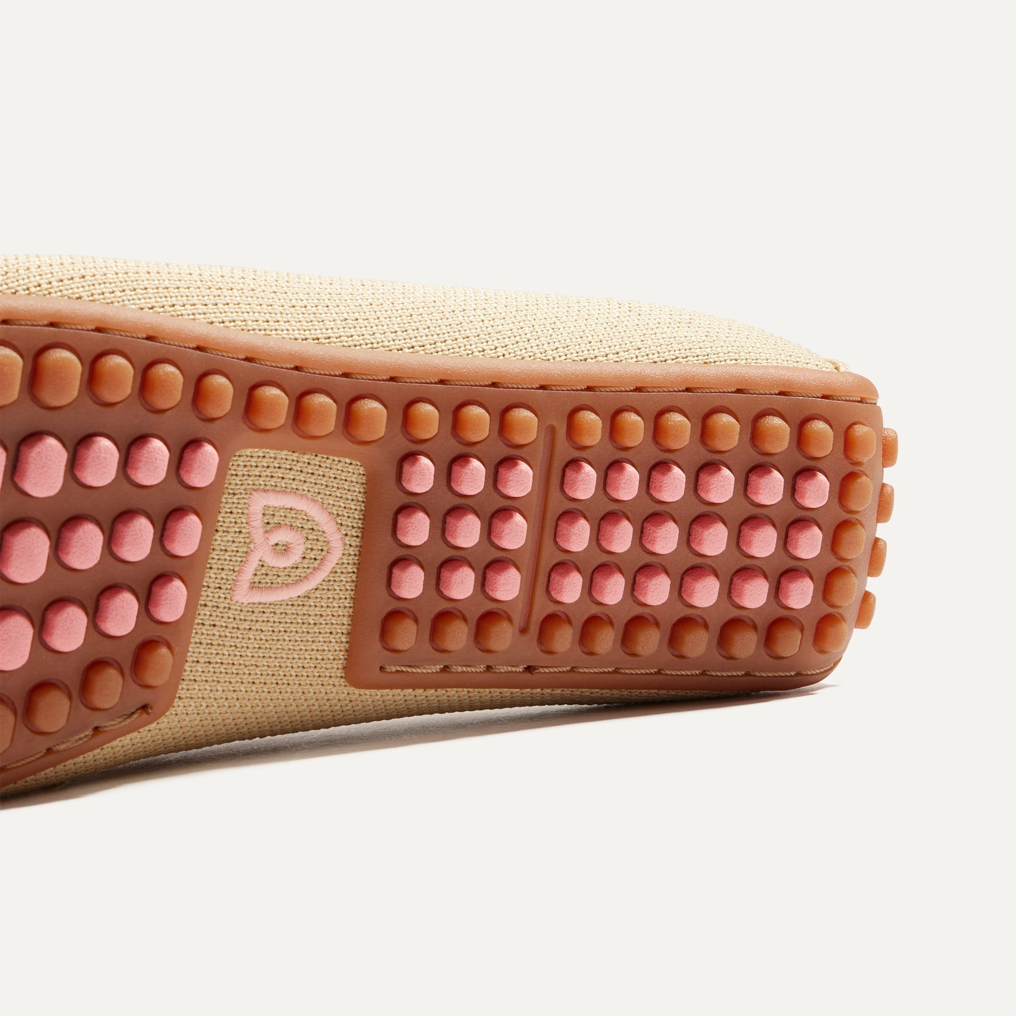 Close up of the outsole of The Braid Driver in Cappuccino.