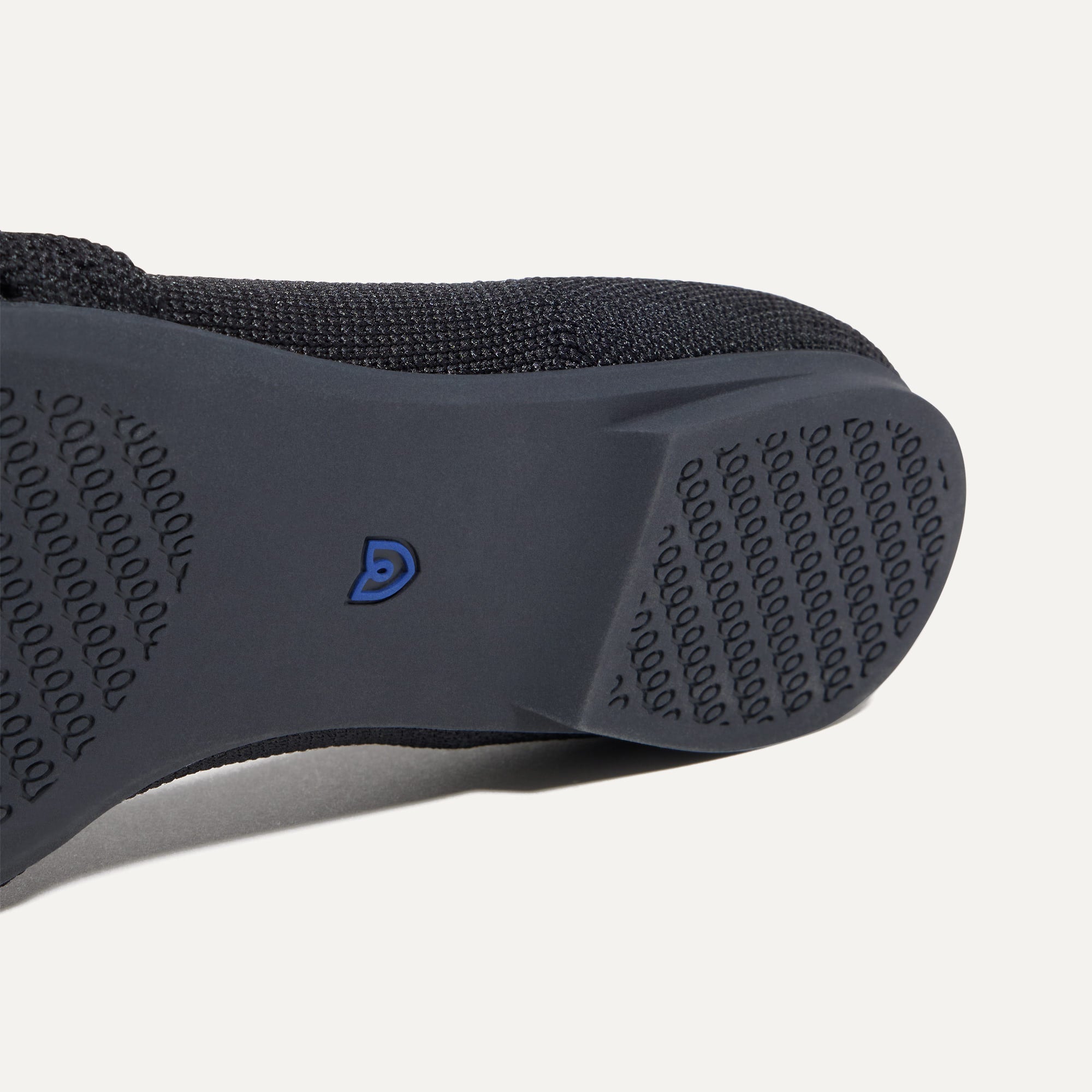 Close up of the outsole of The Knot Point II in Black, shown in a diagonal view. 