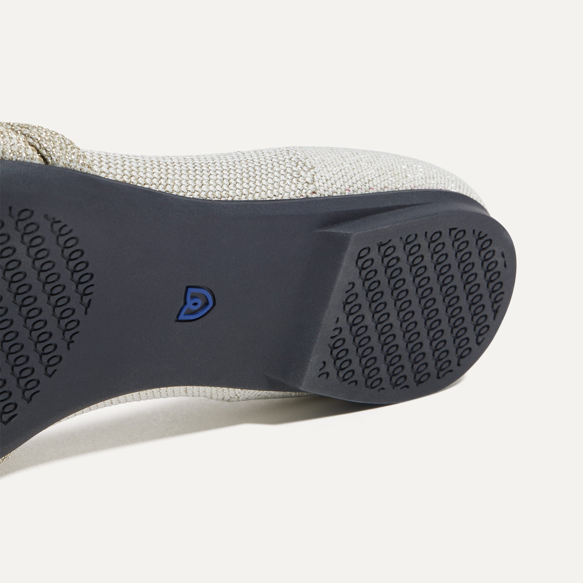 Close up of the outsole of The Knot Point II in Diamond Metallic, shown in a diagonal view. 