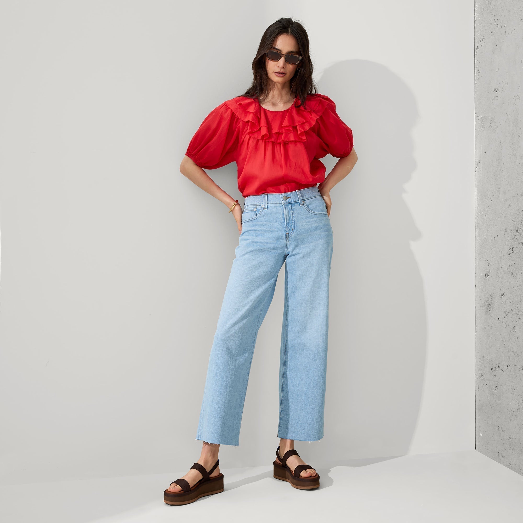 Alternative view of a model wearing The Lightweight Wedge Sandal in Cardamom.