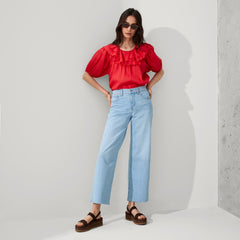 Alternative view of a model wearing The Lightweight Wedge Sandal in Cardamom.