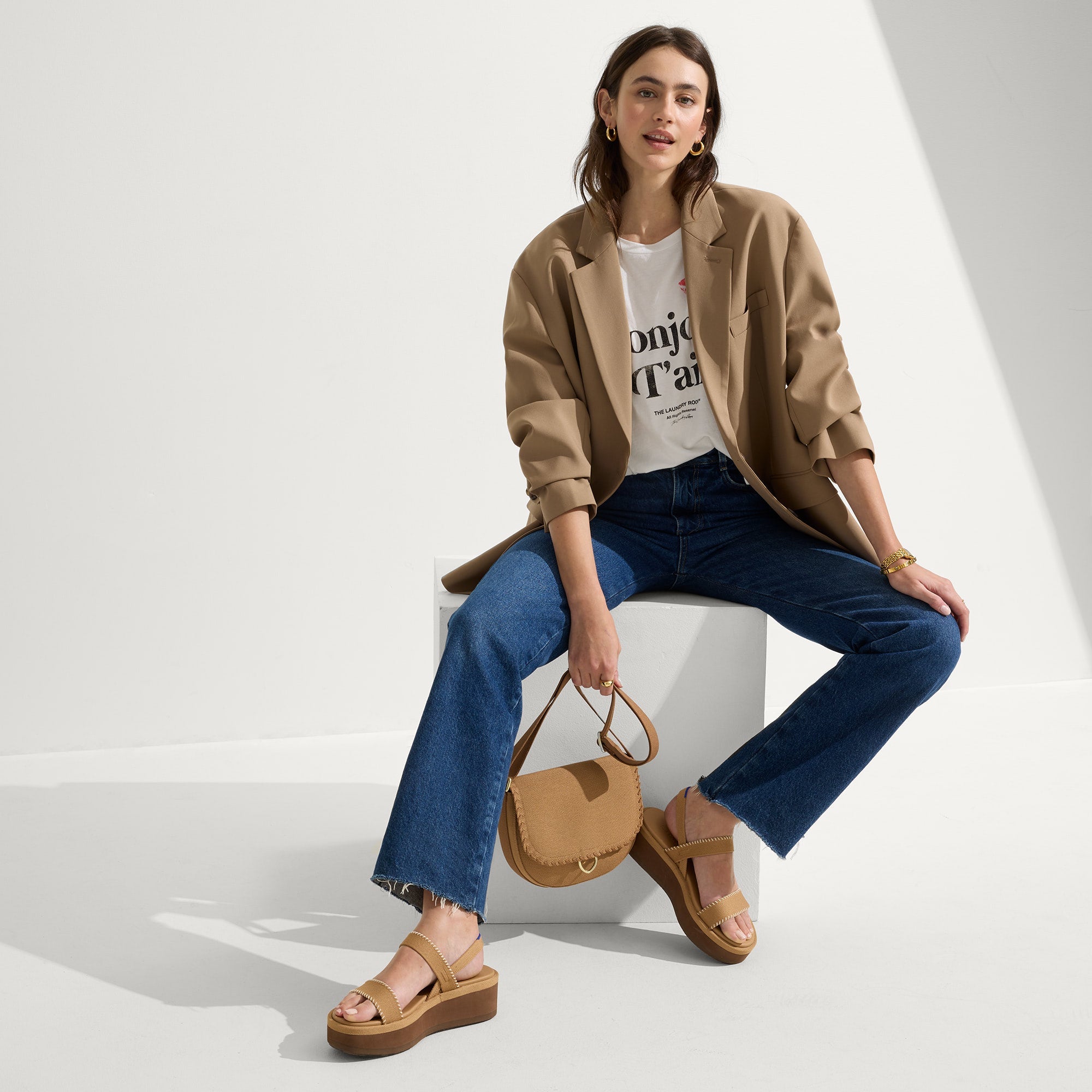 Alternate view of a model wearing The Lightweight Wedge Sandal in Wren Whipstitch.