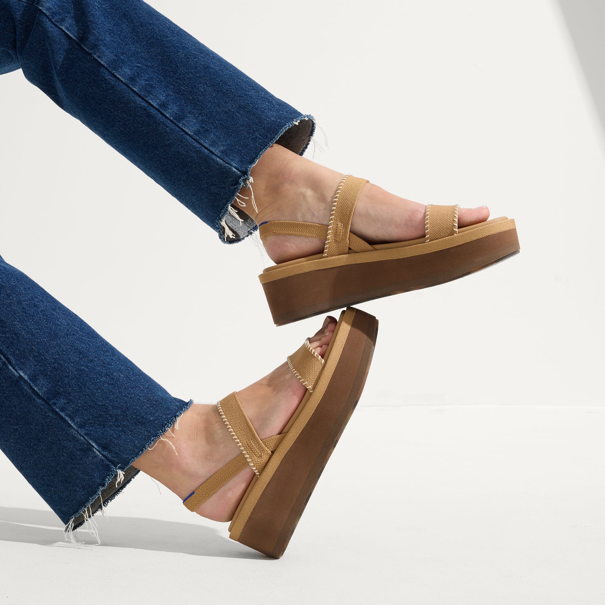 hover | Model wearing The Lightweight Wedge Sandal in Wren Whipstitch.