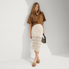 Alternate, close up view of a model wearing The Summer Sandal in Golden Sun. 