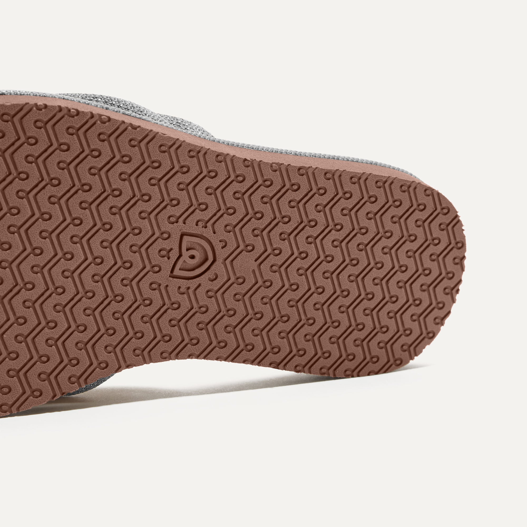 Close up of the outsole of The Summer Sandal in Silver.