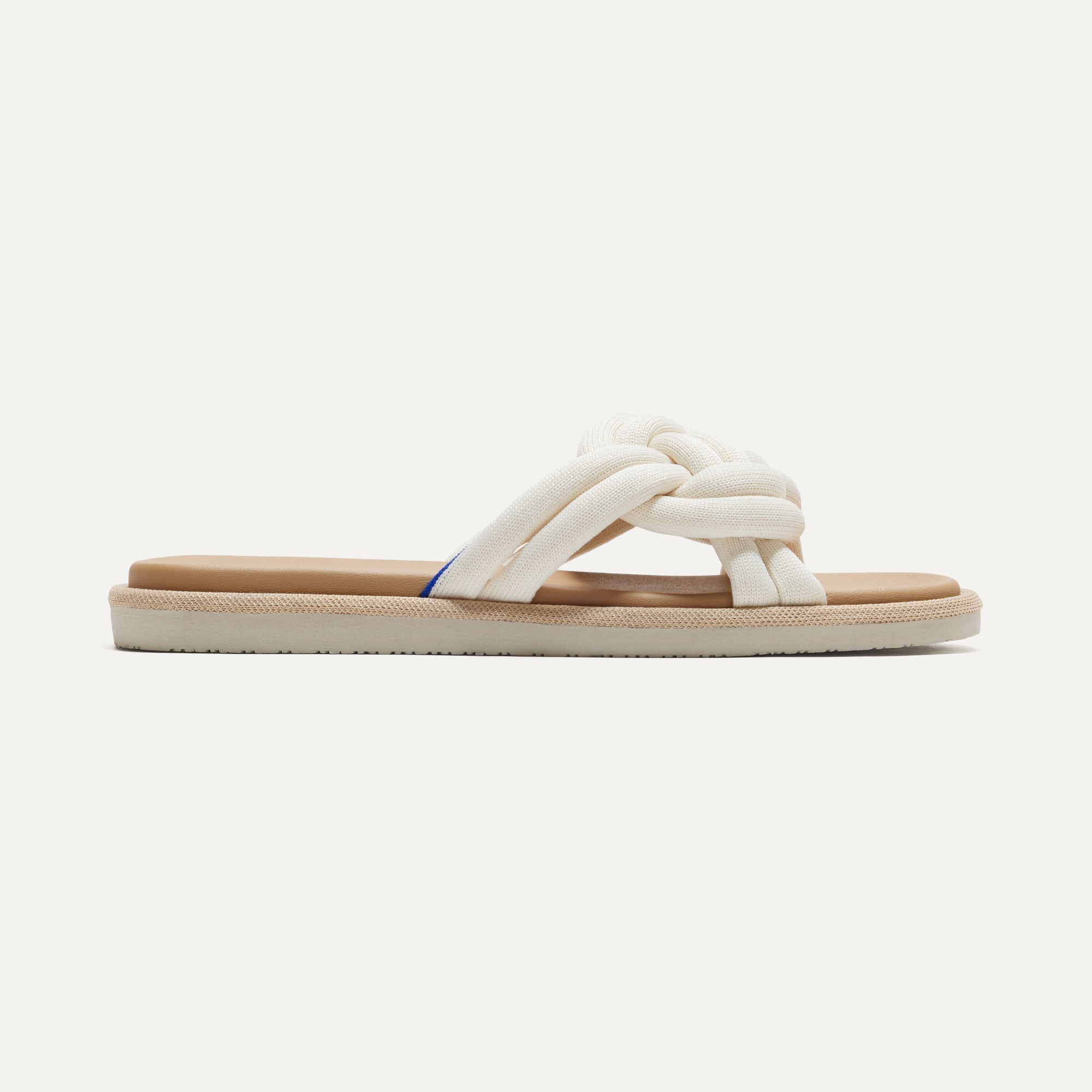 The Summer Sandal in White Sand shown from the side.