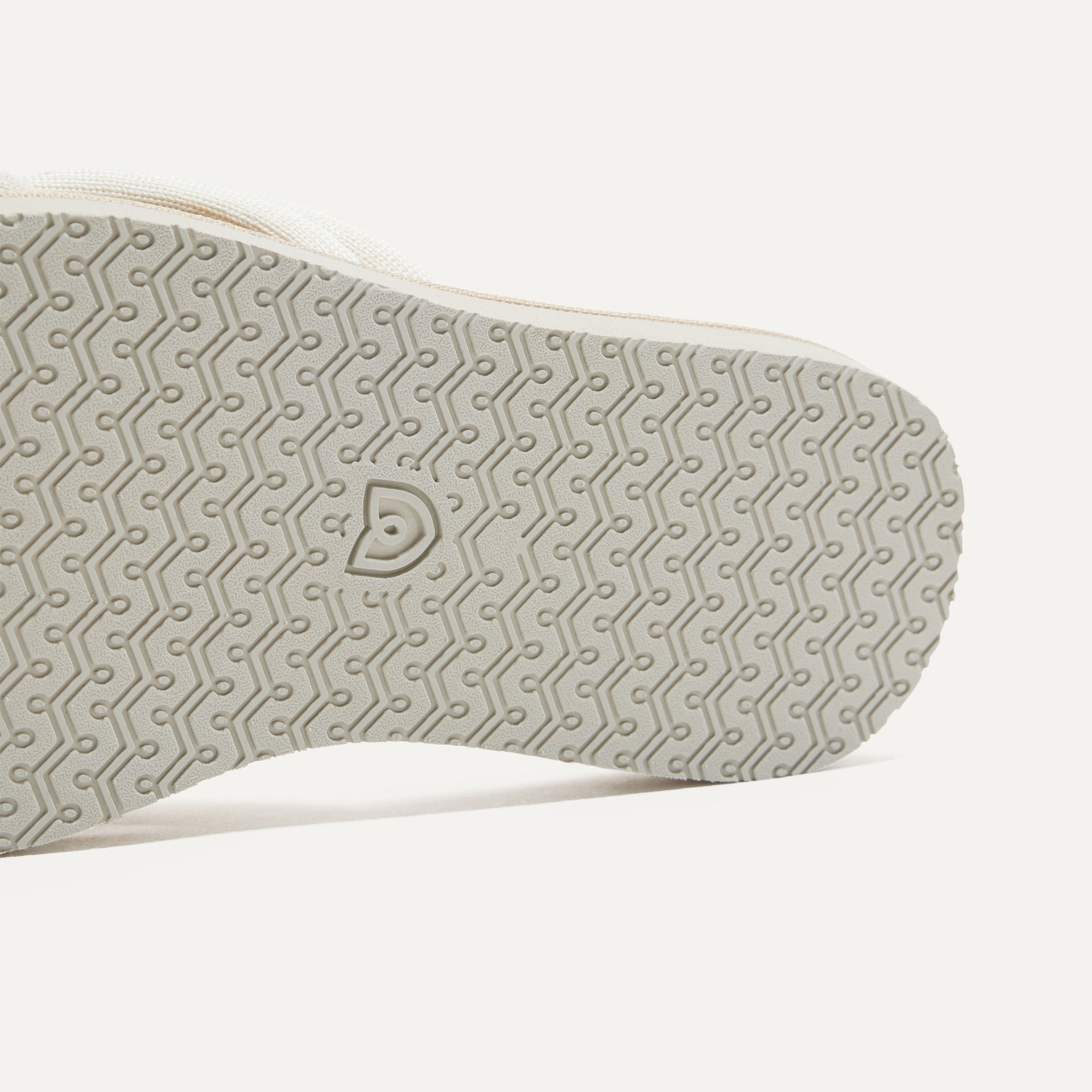 Close up of the outsole of The Summer Sandal in White Sand.
