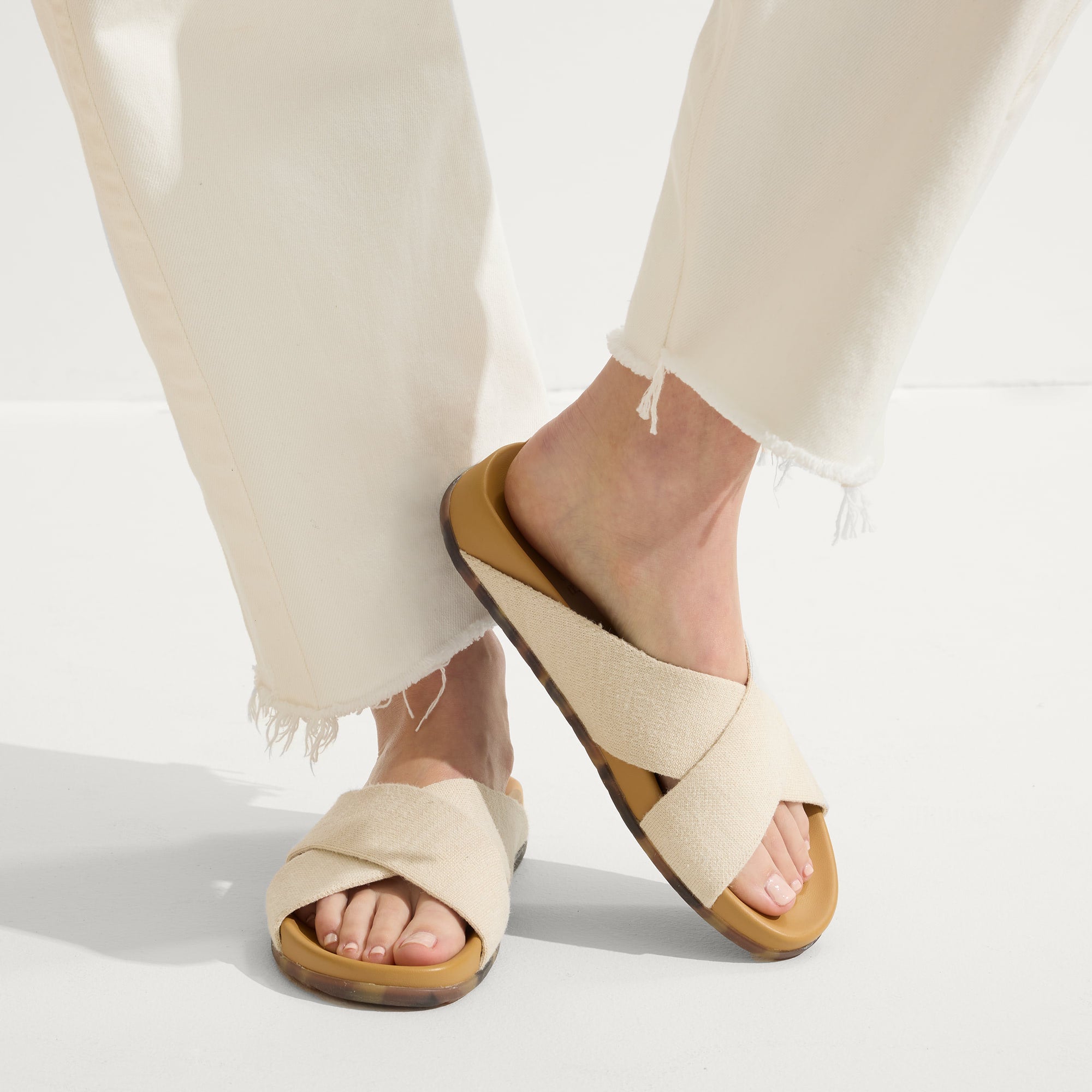 hover | Model wearing The Weekend Slide in Oat.