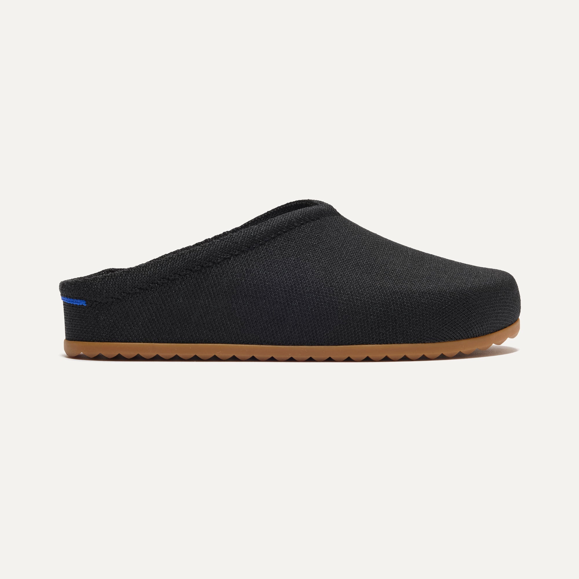 The Casual Clog in Black shown from the side.