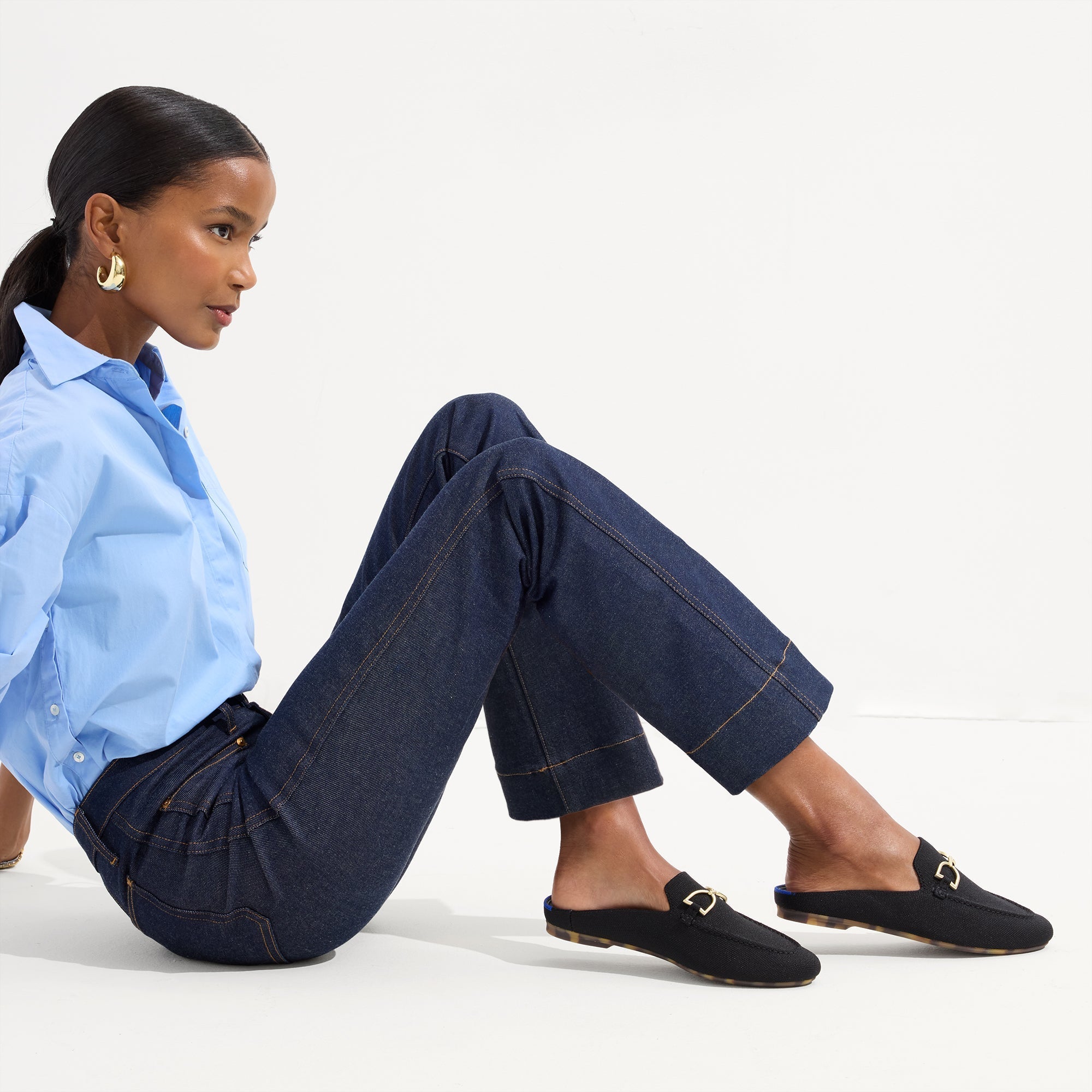Alternate view of a model wearing The Double Bit Loafer Mule in Black.
