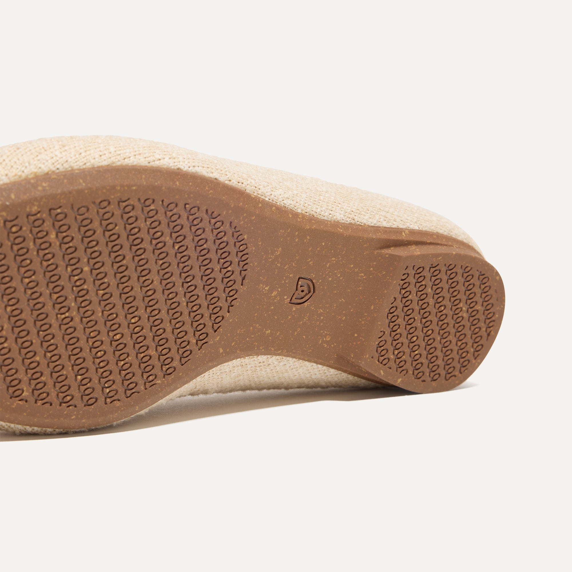 Close up of the outsoles of The Double Bit Loafer Mule in Bunny Bouclé.