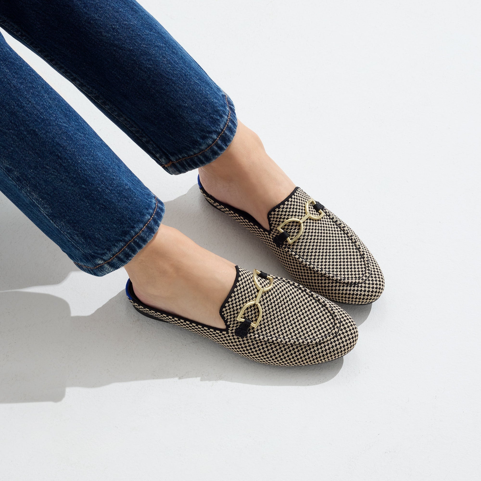hover | Model wearing The Double Bit Loafer Mule in Classic Micro Check.